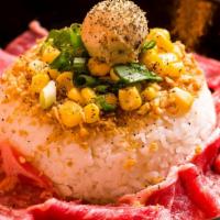 Garlic Beef Pepper Rice · Topped with Green Onions, Corn, Garlic Butter and Fried Garlic.