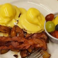 The Royal · 2 eggs benedict, home fries, 2 pieces of bacon, and a cup of fresh fruit