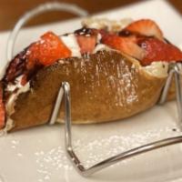 Sweet Pancake Tacos · Three pancake shells filled with banana, Nutella, and strawberries.