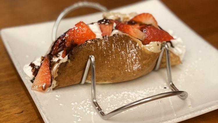 Sweet Pancake Tacos · Three pancake shells filled with banana, Nutella, and strawberries.