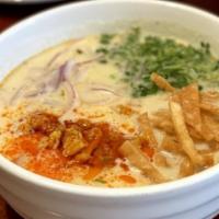 Coconut Milk Noodle · A rich and creamy coconut soup with flour noodles and chicken (fresh and all natural). Serve...