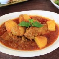 Burmese Chicken Curry · Burmese red chicken curry made with all natu - ral fresh chicken, onion, garlic, ginger, cum...