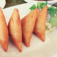 Samosa · Fried lour wrapper filled with potatoes, onion and spices. Can be arranged for vegetarian.