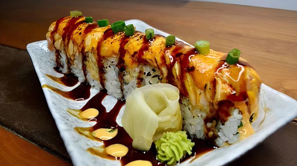 Lion King · Inside: imitation crab, avocado, cucumber. Outside: baked salmon with spicy mayo and unagi sauce