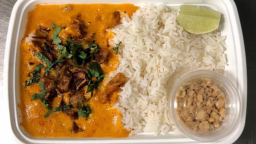 Spicy Pork Curry · Roasted Pork, Spicy Red Coconut Curry, Fresh Herbs, Lime and Crispy Shallots.