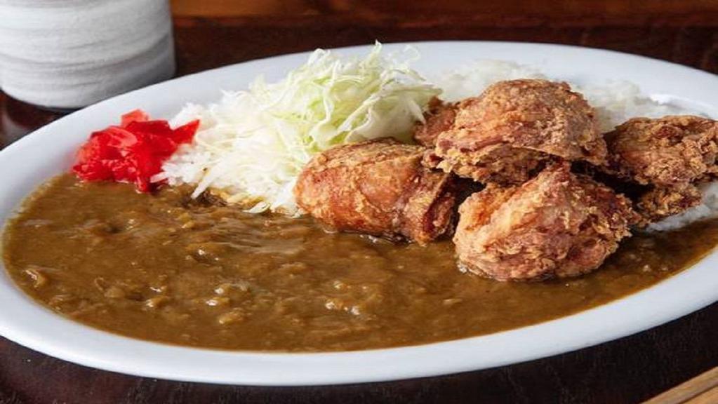 Karaage Curry · Slow Cooked Famous Japanese Curry Served Over Our Famous Chicken Karaage .  Served With Miso Soup