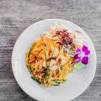 PAD THAI  · Fresh rice noodle stir fry with egg, dry shrimp, dry daikon, bean sprout, chive, tofu, and t...