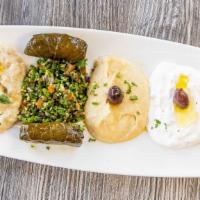 Mezze Combo Plates · Hummus, Baba ganoush, tzatziki, dolma, tabbouleh and falafel.