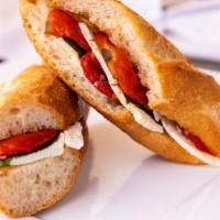 Caprese Baguette · Sweet baguette with fresh mozzarella slices, fresh basil, fire roasted tomatoes, and salt & ...