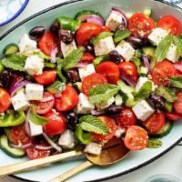 Greek Salad · Cucumbers, tomatoes, red onion, Kalamata olives, feta cheese on Romaine lettuce, served with...
