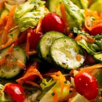 Veggie Garden Salad · Tomatoes, cucumbers, avocado, mushrooms, bell peppers on Romaine lettuce or spring mix, serv...