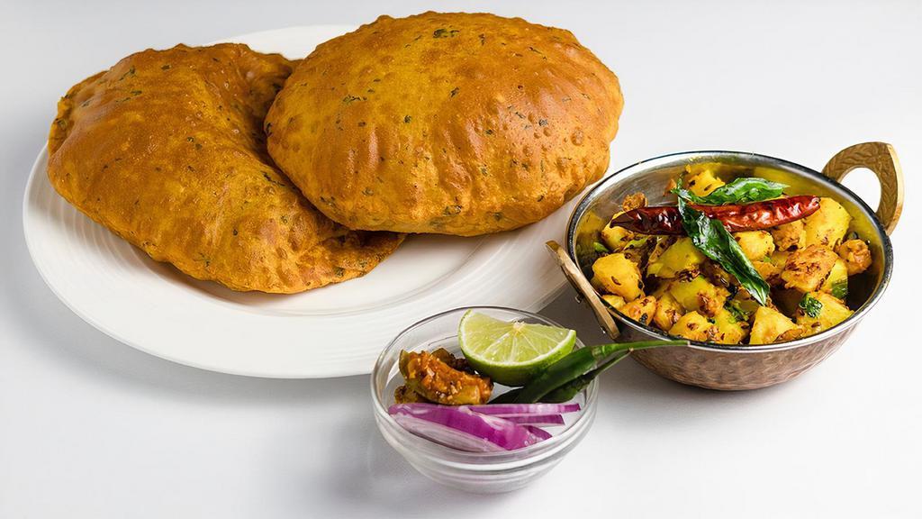Methi Poori with Bhaji · Deep fried puﬀed whole wheat and fenugreek bread served with delicately spiced potatoes.