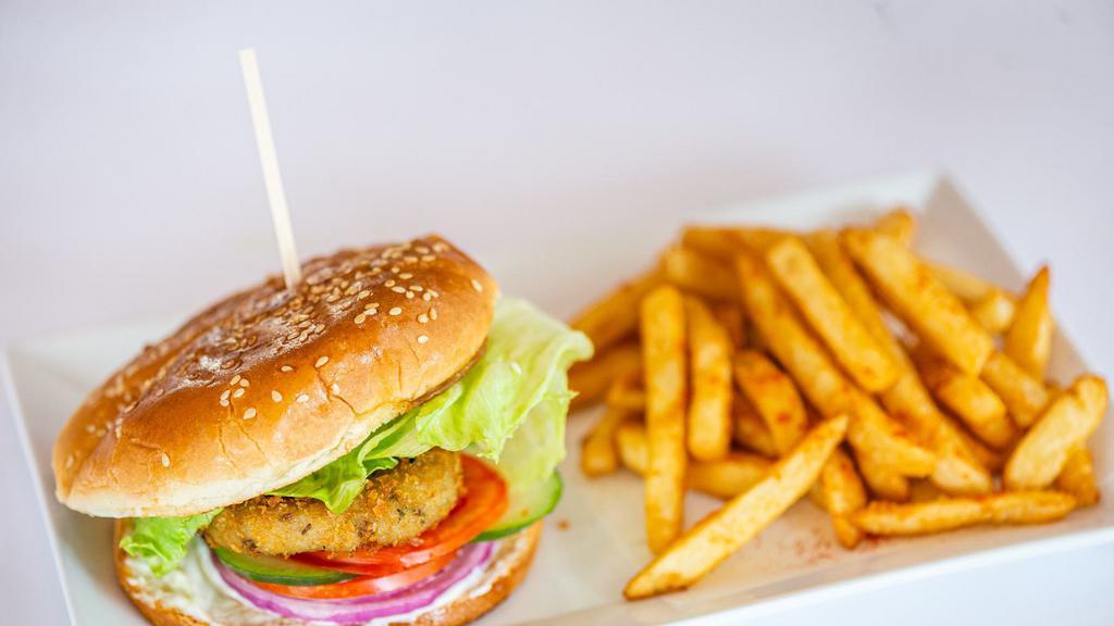 Vegetable Burger · Indian style burger with potato fries and choice of soda.