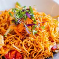 Bombay Chinese Bhel · Crispy noodles tossed with bell peppers, carrots, cabbage, spring onions and sauces.