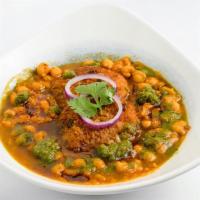 Aloo Tikki with Chana · Spiced potato patty served with garbanzo curry and chutneys.
