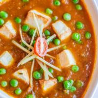 Matter Paneer · Homemade cheese cooked in special gravy with green peas.