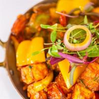 Chili Paneer · Homemade cheese cooked with bell pepper, ginger, garlic and herbs.