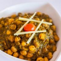 Chana Saag · Garbanzo beans cooked with fresh spinach, herbs and spices.
