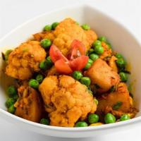 Aloo Gobi Mattar · Cauliflower cooked with potatoes, peas and spices.