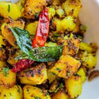 Aloo Methi 25 · Potatoes and fresh fenugreek cook with 25 herbs and spices.
