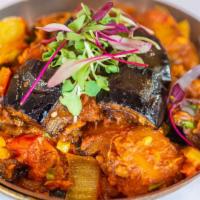 Aloo Baingan · Eggplant and potatoes cooked together with ginger, garlic, tomato and Indian spices.