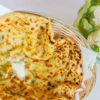Gobi Paratha · Pan cooked whole wheat bread stuffed with cauliflower and spices.