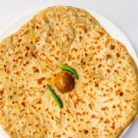 Paratha · Pan cooked whole wheat Indian bread.