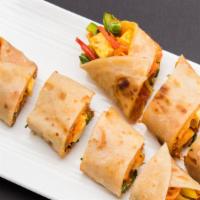 Chili Paneer Wrap · Chili paneer wrapped in plain paratha or spinach paratha served with chaas or soda.