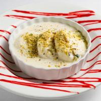 Ras Malai · Miniature poached cottage cheese dumplings soaked in sweetened saffron flavored reduced milk.