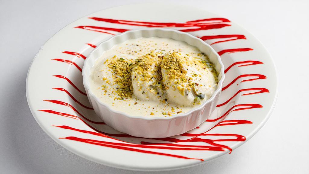 Ras Malai · Miniature poached cottage cheese dumplings soaked in sweetened saffron flavored reduced milk.