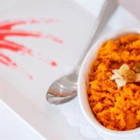 Gajjar Halwa · Shredded carrots pudding mixed with nuts and dried fruits.