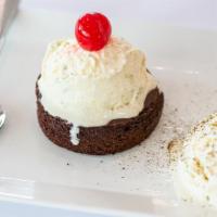 Chocolate Lava Cake · Chocolate cake with soft chocolaty molten center, served with a scoop of a vanilla ice cream.