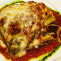 Lasagna · Traditional Italian baked lasagna, layers of homemade pasta sheets with fresh imported Itali...