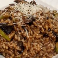 Risotto ai Funghi Porcini  · Vegetarian. Risotto with fresh porcini and champignon mushrooms, asparagus and Italian Parme...