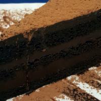 Torta al Cioccolato / Chocolate Cake · Traditional Italian layer chocolate cake, filled with a rich chocolate cream, covered with c...