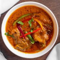 Goat Curry · Classic goat curry with garlic, ginger, peppercorns, turmeric and a touch of cumin