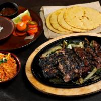 CARNE ASADA LARGE · chimichurri marinated steak, beans, salsa, escabeche, tortillas
