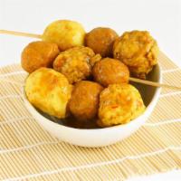 Curry Seafood Skewers · Curry crab, fish and lobster snack balls.