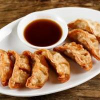 Vegetable Gyoza · Served with soy chili sauce.