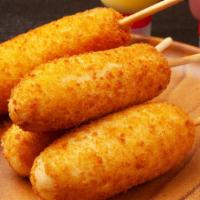 Corn Dog · Delicious beef dog battered and fried to perfection.