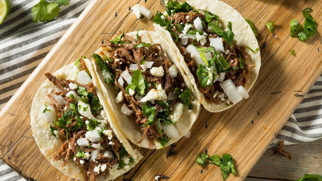 Regular Deshebrada (Shredded Beef) Taco · Incredible House Taco prepared with Shredded beef, beans, cheese, and lettuce.