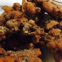 Onion Bhaji · Onions slices with herbs and spices and deep-fried.