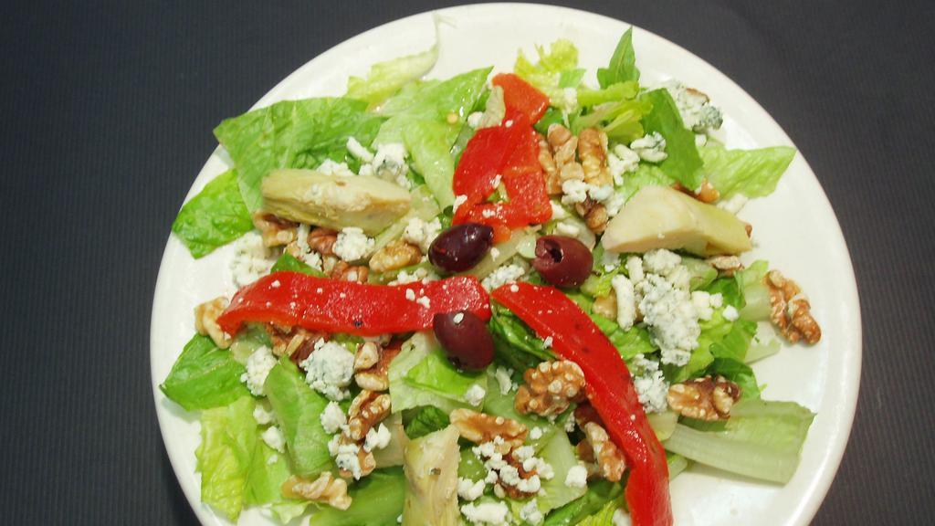 Caesar's Fantasy · Caesar salad, kalamata olives, artichoke hearts, roasted red bell peppers, crumbled gorgonzola and roasted walnuts.