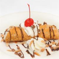 Cannoli · Crispy fried pastry shell stuffed with sweetened ricotta cheese and chocolate chips