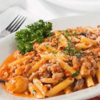 Penne Calabrese · Our family made sweet Italian sausage and fresh mushrooms in a light tomato cream sauce toss...