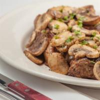 New York Steak · Marinated New York steak, cooked to order,  topped with brandy  mushroom demi-glaze, served ...