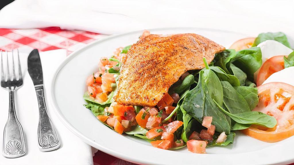 Salmon Delight · Spinach salad tossed with mushrooms, pine nuts and Italian salsa basilico dressing, served with slices of fresh mozzarella and tomato and crowned with grilled salmon.