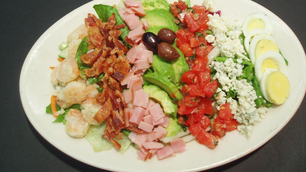 Chef Cobb Salad · An assortment of fresh greens tossed with shrimp, bacon, ham, avocado, tomatoes, and fresh crumbled gorgonzola cheese, your choice of dressing.