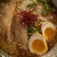 Tonkotsu Ramen · Pork & chicken bones based soup with chashu pork, egg, cabbage, spinach, kikurage, green oni...