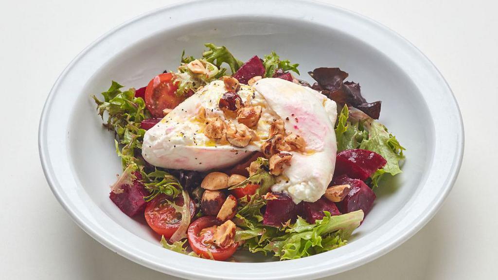 Burrata Cheese · With mixed greens, beets, tomatoes and crushed hazelnuts with extra-virgin olive oil, vinegar and truffle sea salt. (Contains nuts, dairy) Vegetarian
